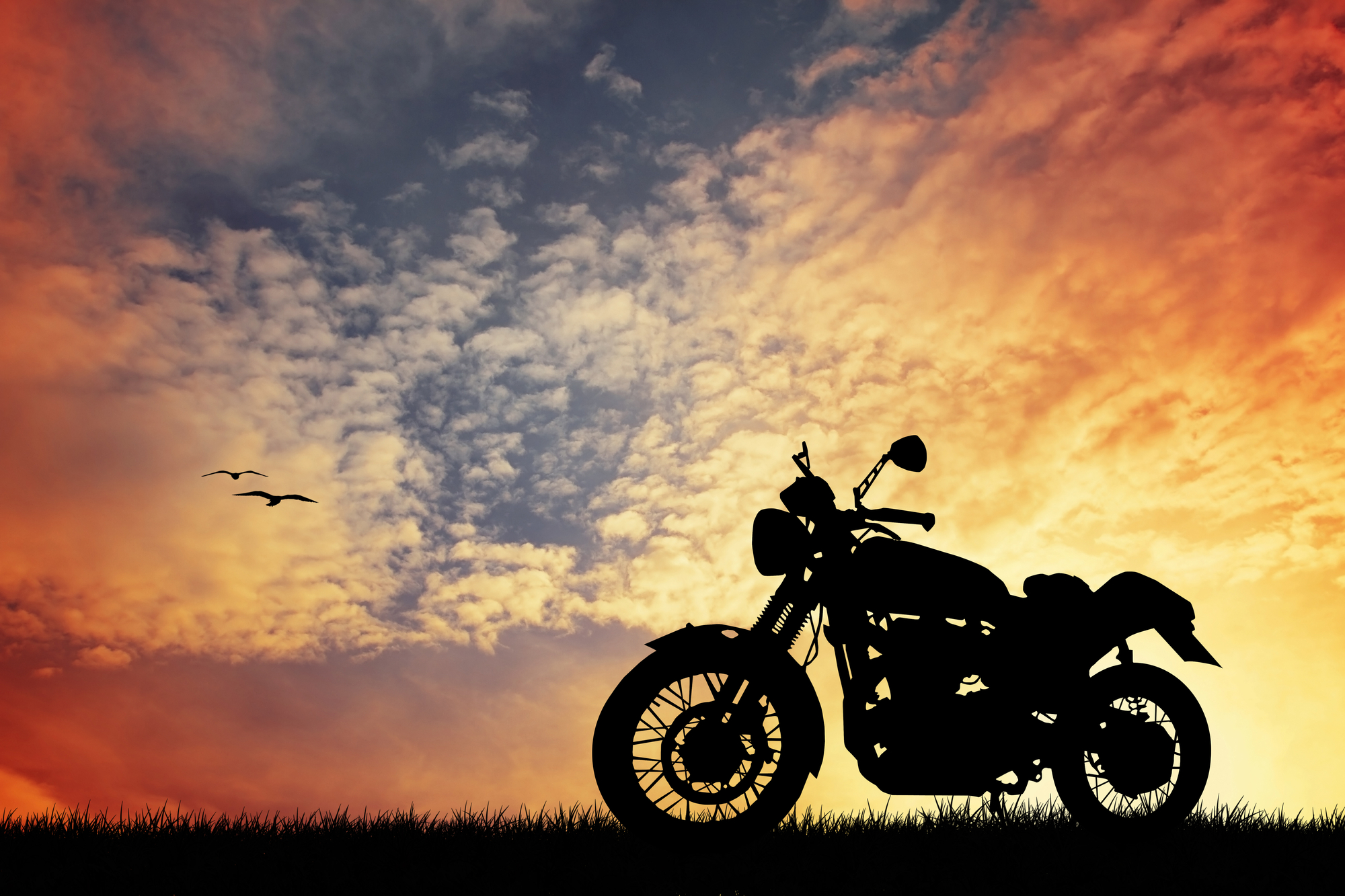 Motorcycle Accident Lawyer New Orleans, LA - motorcycle at sunset