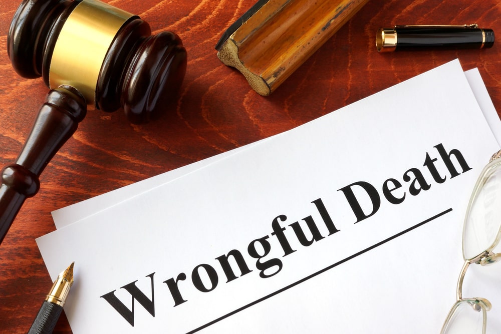 Wrongful death lawyer in New Orleans, LA reviewing case files with client